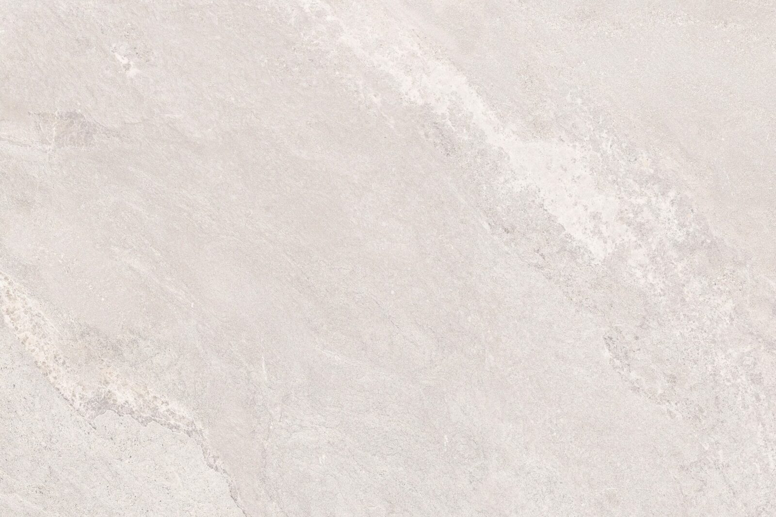 A smooth, light grey stone texture featuring subtle variations and a natural finish.
