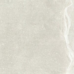A smooth, light grey stone surface with subtle texture and a faint white vein running through it, ideal for design inspiration.